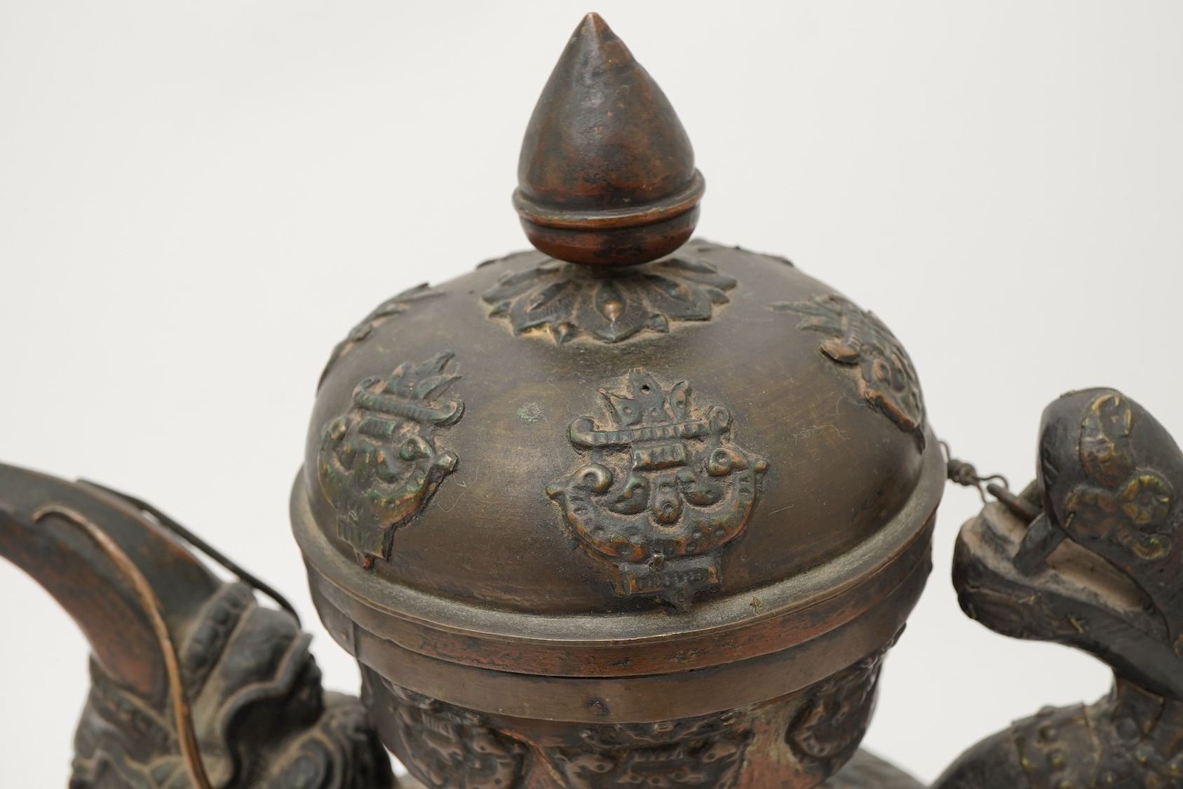 A large Tibetan repoussé brass and copper ewer, 19th century